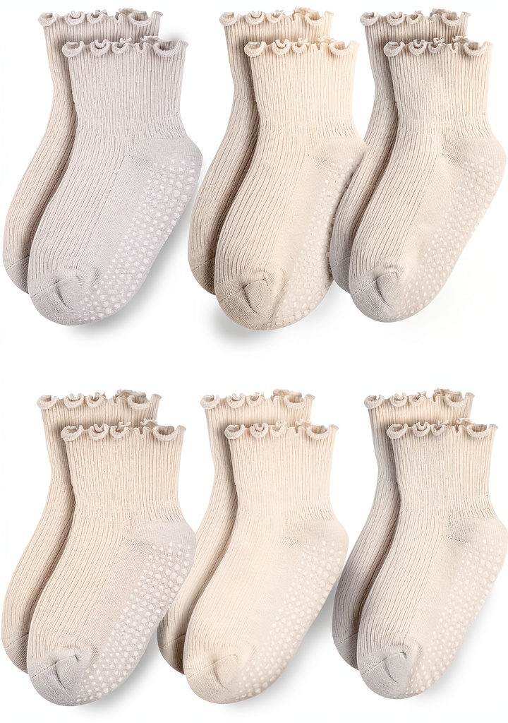 Baby girl wearing ruffled non-slip socks while playing on living room floor